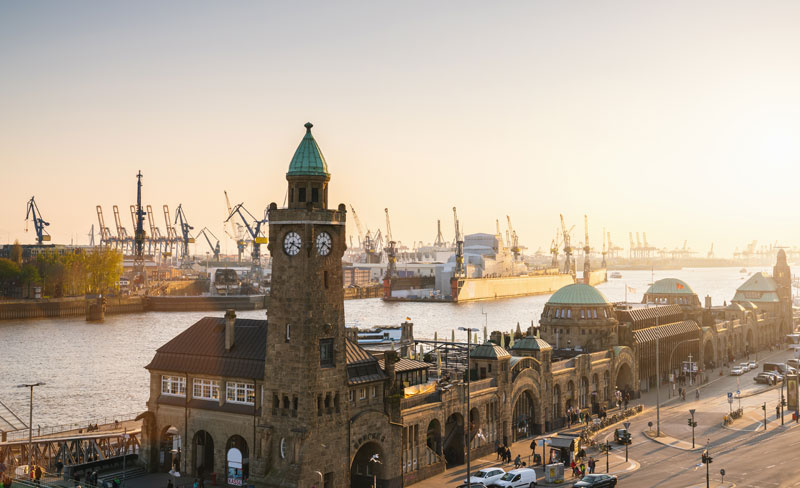 The Port of Hamburg, visible beyond the St. Pauli Landungsbrücken, at sunset